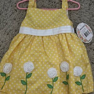 Adorable girl’s dress with polka dots and flowers